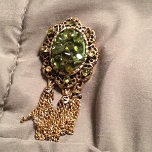 Elegant Green Gemstone Brooch with Gold Accents